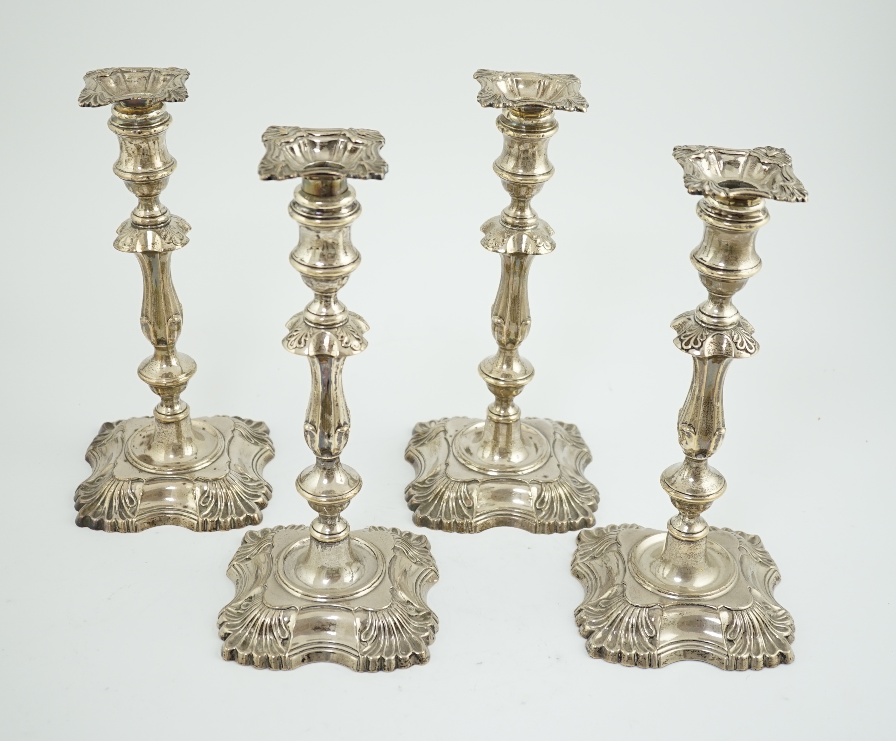 A matched set of four late Victorian/Edwardian silver candlesticks, by William Hutton & Sons Ltd